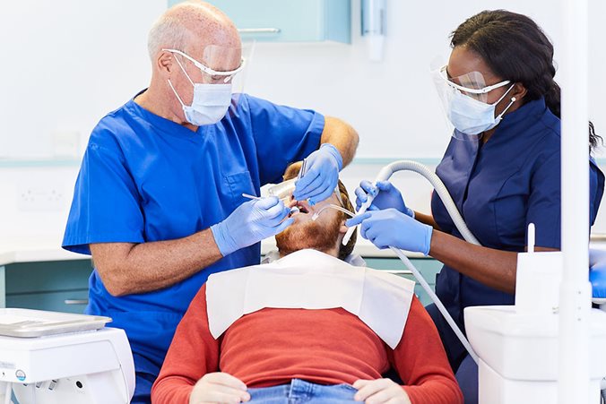 Dental-Fillings-Inlays.jpg Patient receiving treatment by dentist