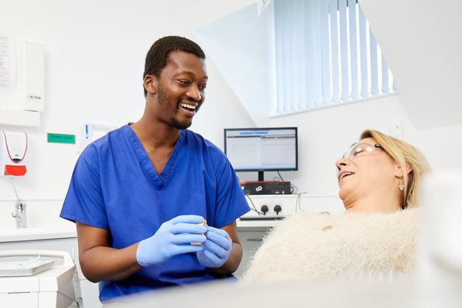 Sedation.jpg Dentist discusses treatment with patient